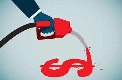 a hand holding a gasoline hose that is pouring out fuel in the shape of a dollar sign