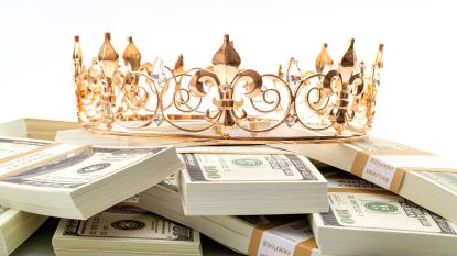 A gold crown sitting on stacks of hundred dollar bills best dividend stocks